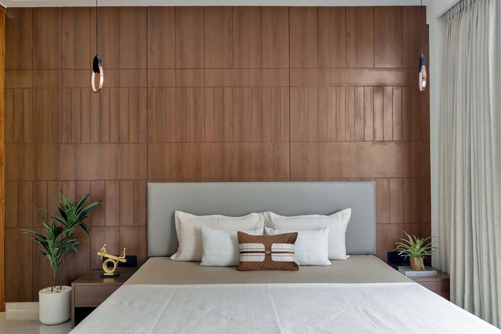 Shubham Sky sample flat bedroom with wood panel headboard wall